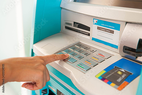 Enter ATM code,Withdrawing money from an ATM,Enter the code on the ATM keyboard