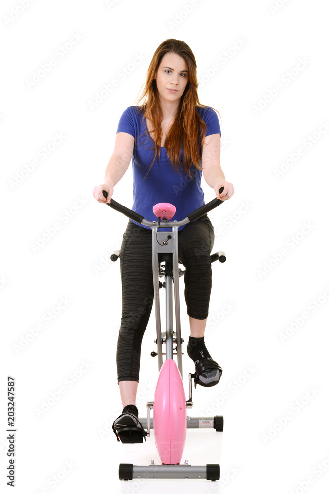 woman fitness cardio workout on an exercise bike woman fitness cardio workout on an exercise bike