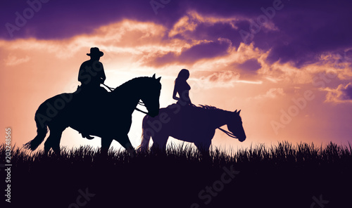 Fototapeta Naklejka Na Ścianę i Meble -  couple on horseback at sunset