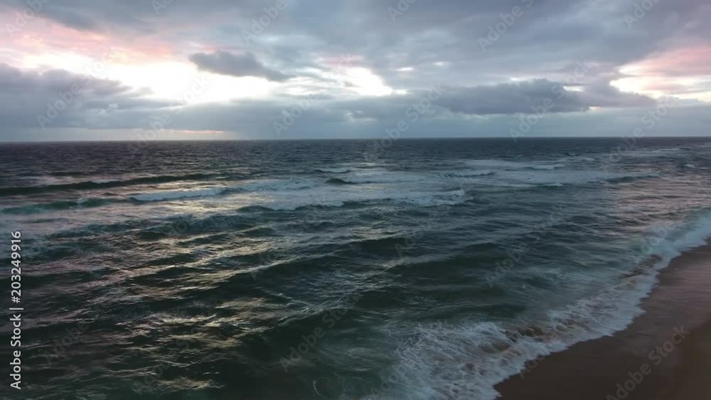 windy sunset on a beach at atlantic ocean, 4k rotating landscape footage (france) windy sunset on a beach at atlantic ocean, 4k rotating landscape footage (france)