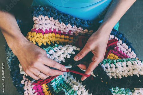The woman is crocheting. photo