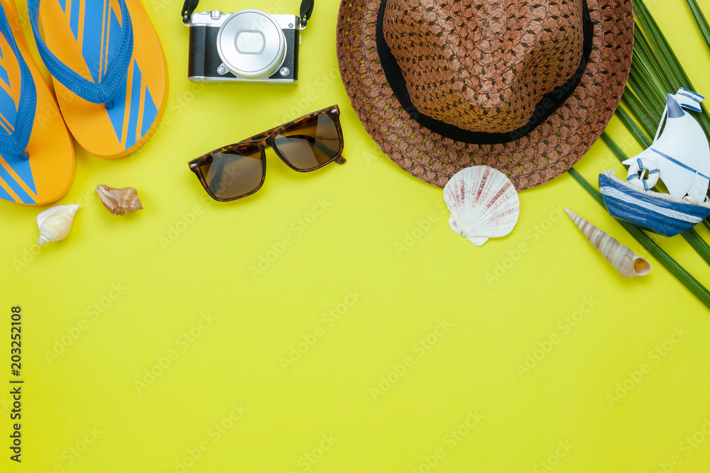 Table top view aerial image of accessory for summer travel holiday   lay essential objects for beach vacation on modern yellow  paper at office  space for creative design text. Stock Photo |