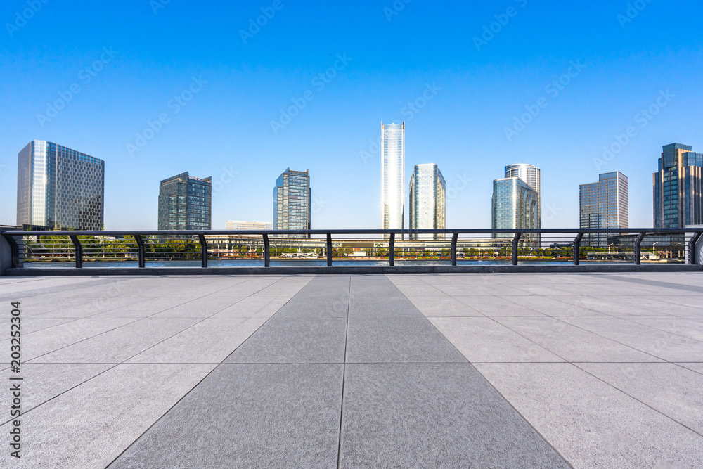 city skyline with empty marble floor
