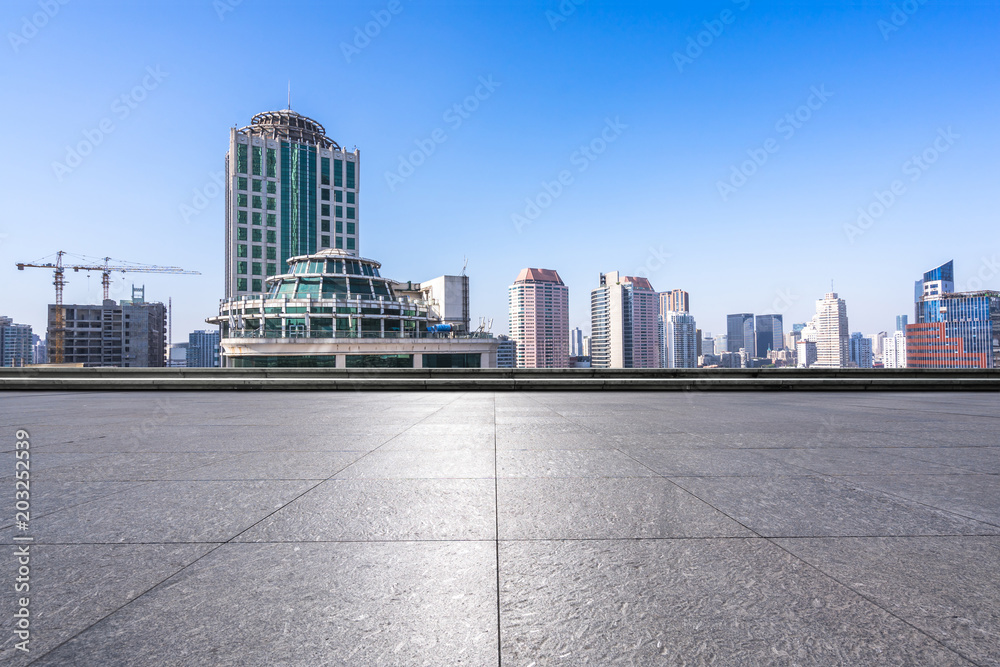 city skyline with empty marble floor