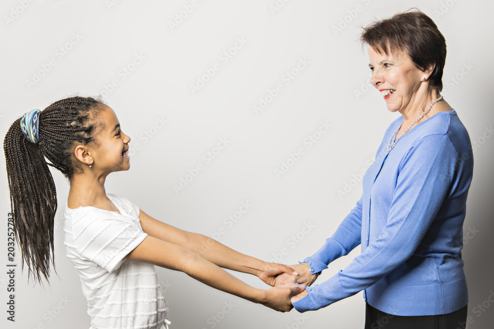 black girl child with grandmother in studio white background black girl child with grandmother in studio white background