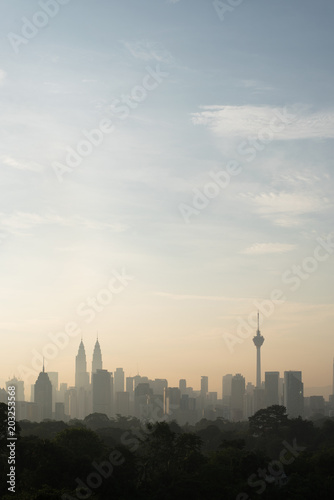 vertical or potrait image of Beautiful Kuala Lumpur cityscape skyline in the morning environment and the buildings in silhouette. tourism and development concept