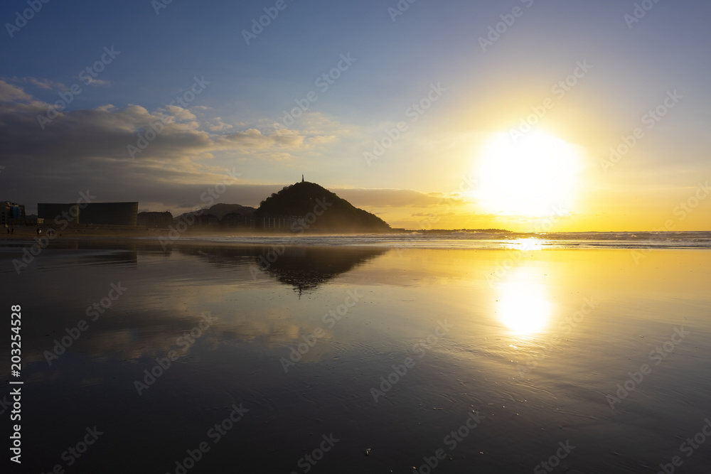 Mount Urgull reflected on the beach, city of San Sebastian (Donostia), Basque Country