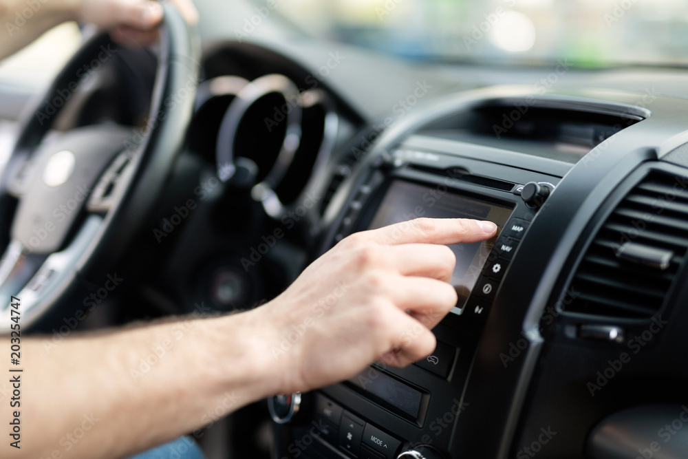 Man using navigation system while driving car