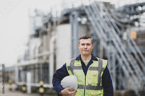 Portrait of mature industrial worker on site
