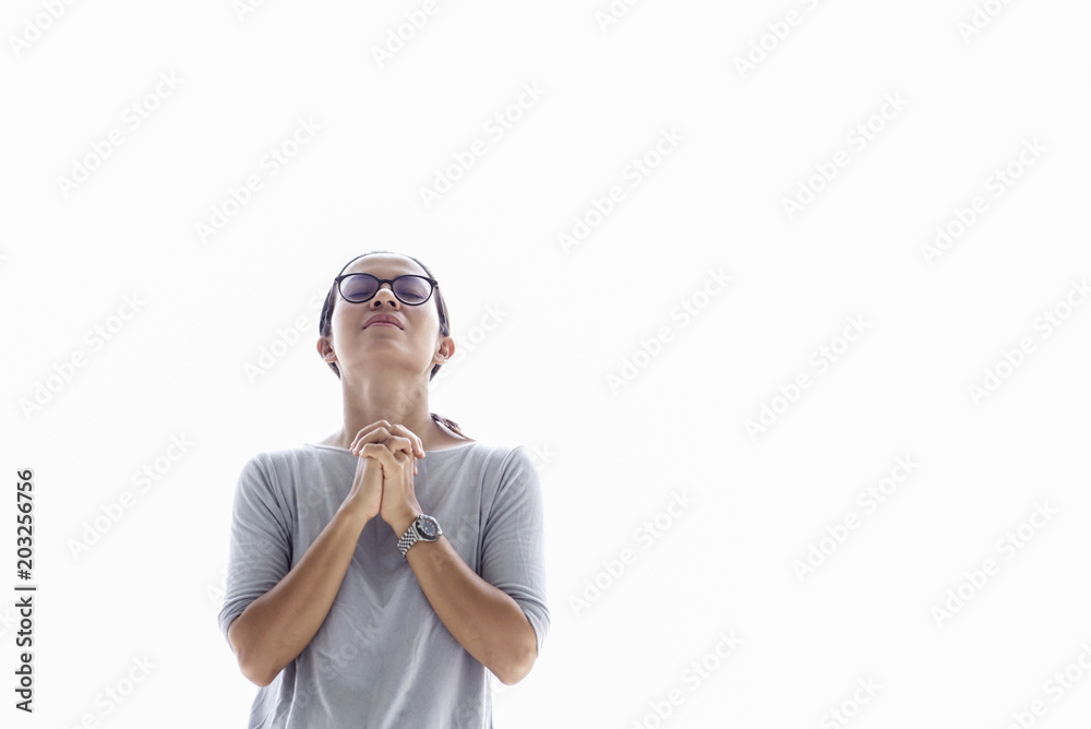 Young asia woman praying on white background Young asia woman praying on white background