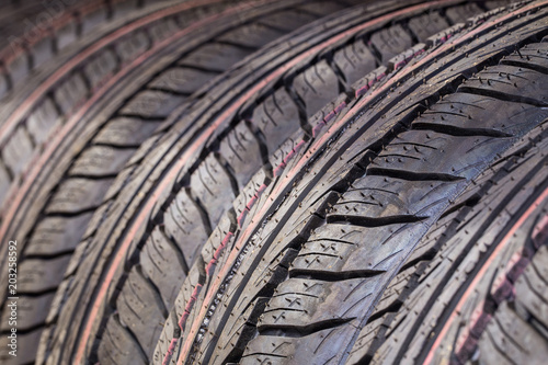 Car tires in a row. Selective focus. © artem_goncharov