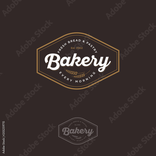 The bakery logo with spikelet. Bread and baking emblem. Vintage bakery logo. Gold and white inscription on a dark background.