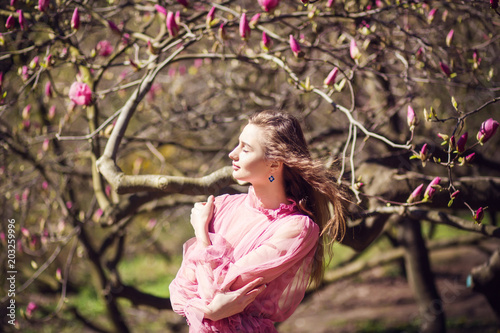 girl posing in magnolia garden