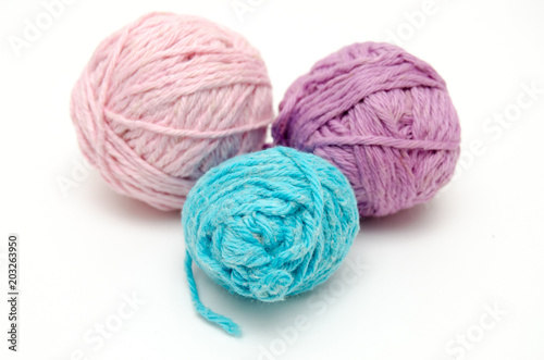 Colorful balls of yarn isolated on white