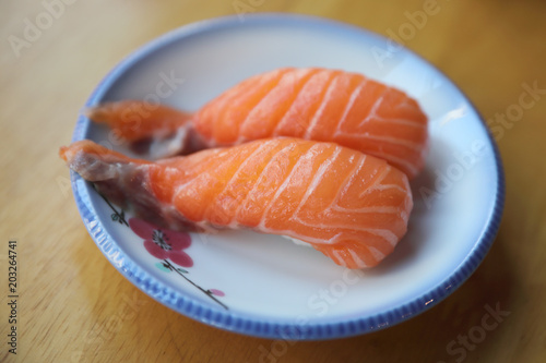 Salmon sushi on wood background