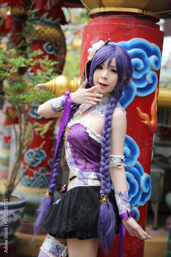 Portrait of asian young woman with purple Chinese dress cosplay with temple