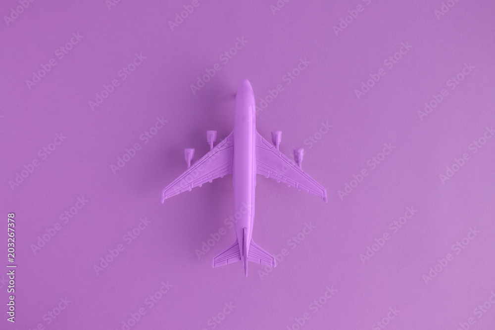 High angle view of model commercial plane purple color concept. High angle view of model commercial plane purple color concept.