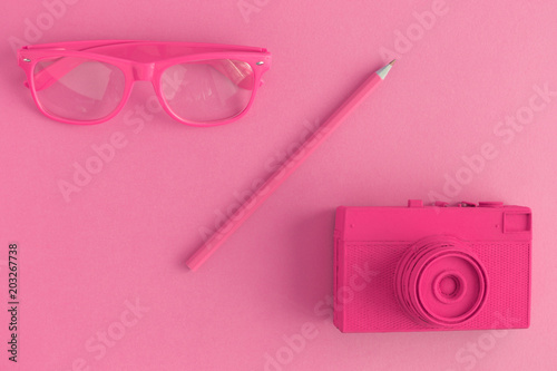 Pink objects on pink background minimal creative photography concept.