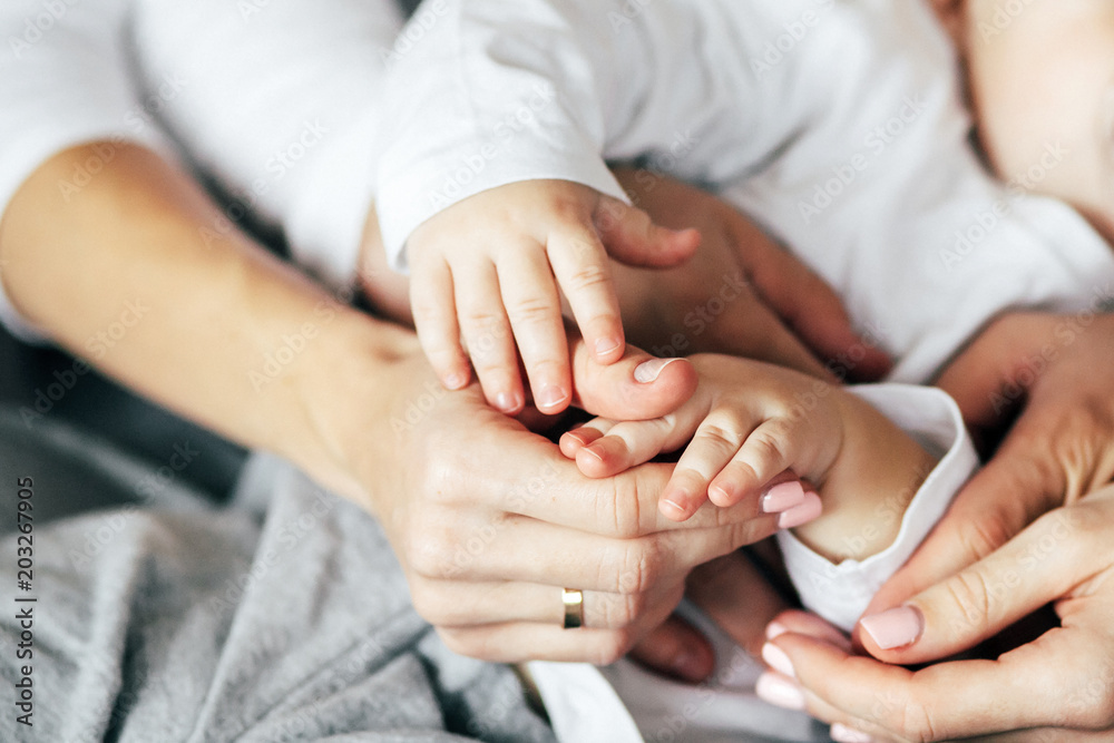 Young family hands touching each other. Mother, father and child. Young family hands touching each other. Mother, father and child.
