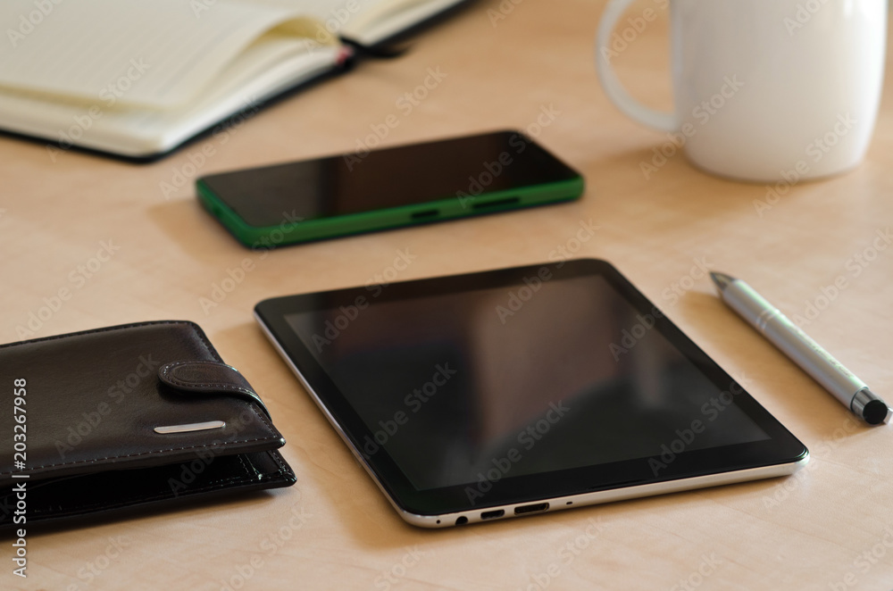 Tablet and phone on a desk Tablet and phone on a desk