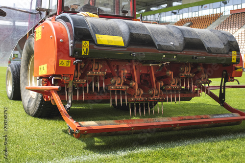 Detail of aeration machine during grasslands football field