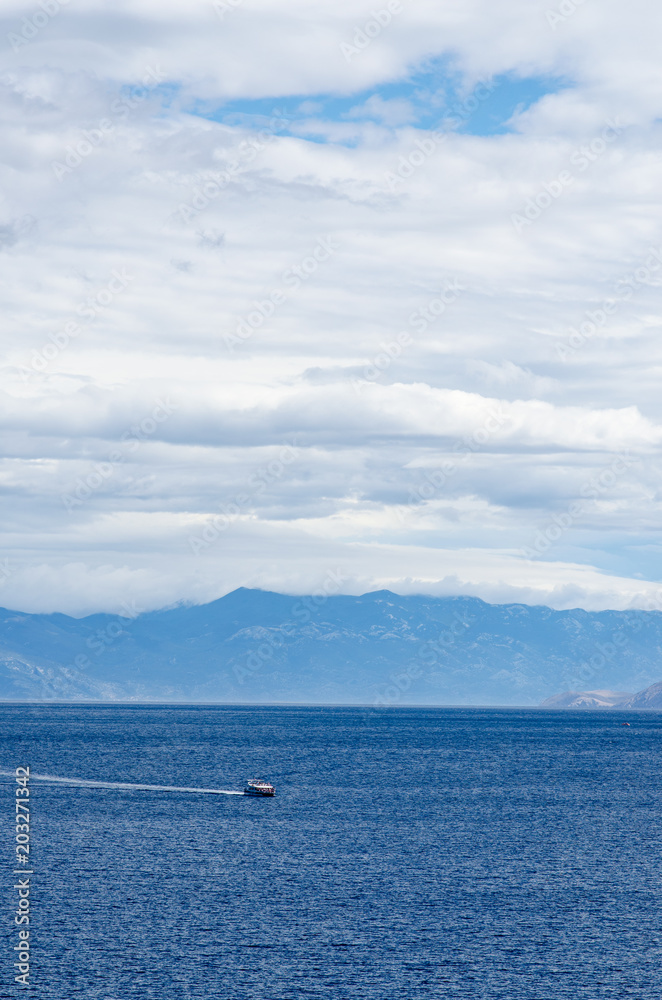 Boat in the sea near mountains