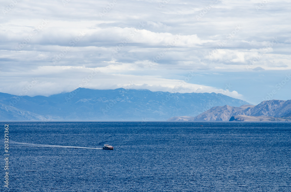 Boat in the sea near mountains