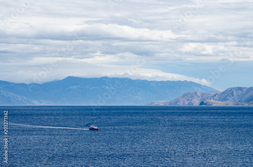 Boat in the sea near mountains