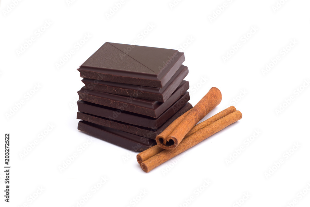 Stack of dark chocolate pieces isolated on white Stack of dark chocolate pieces isolated on white