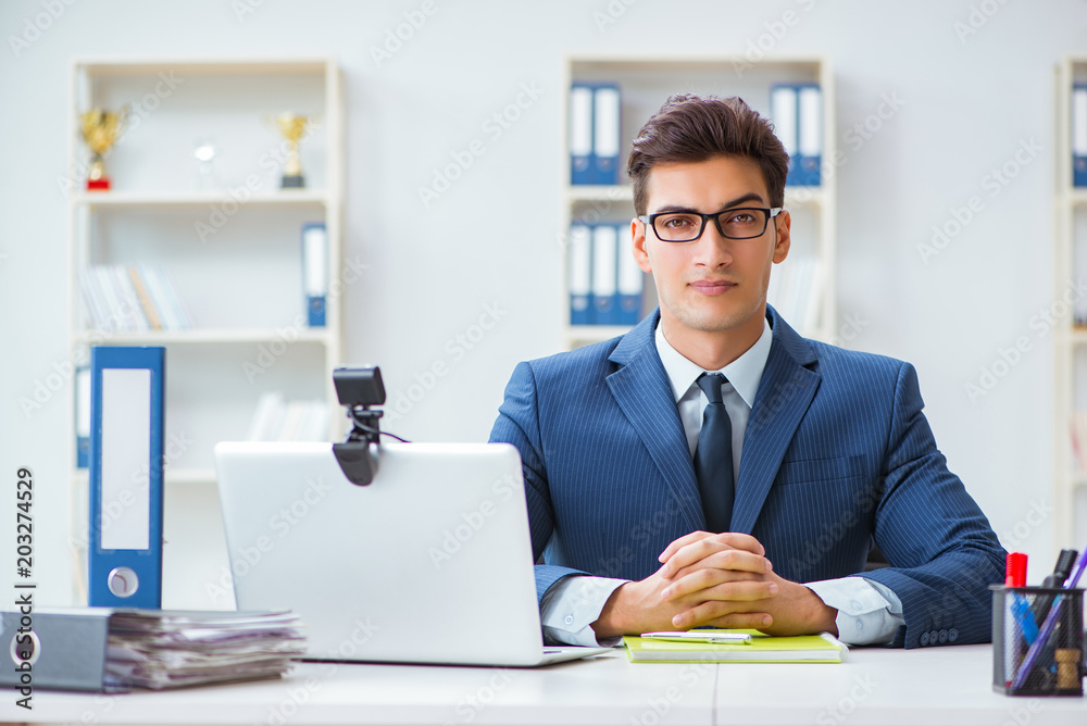 Young help desk operator working in office Young help desk operator working in office