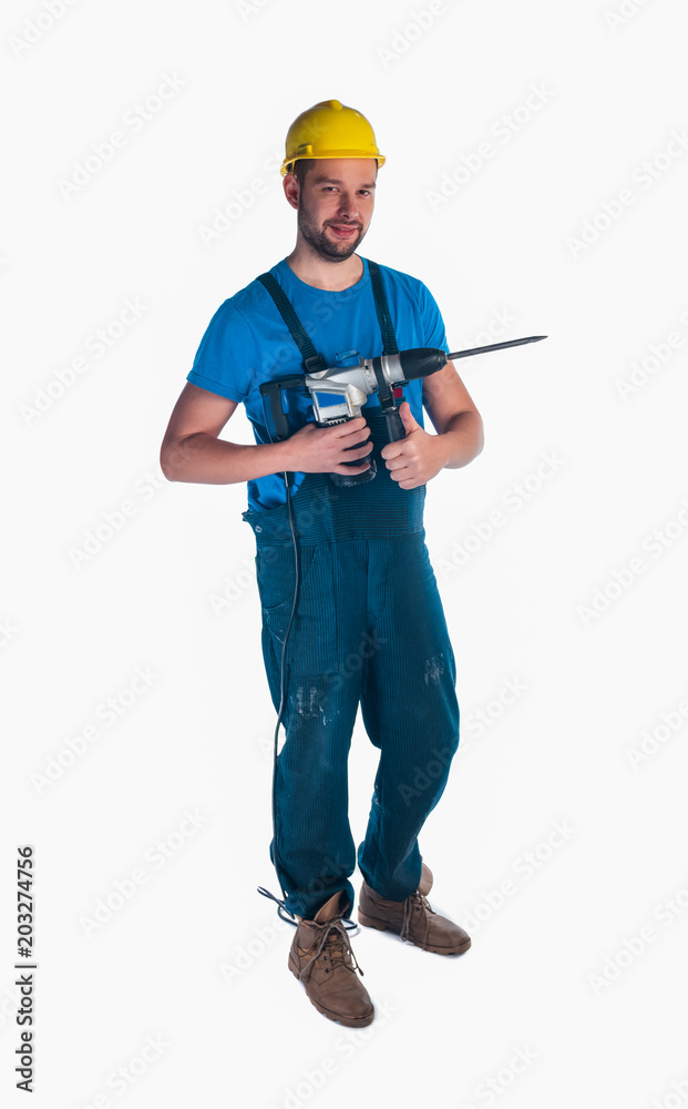 Serviceman holding a drill on white background Serviceman holding a drill on white background