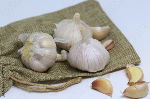 Garlic for cooking on wooden floor