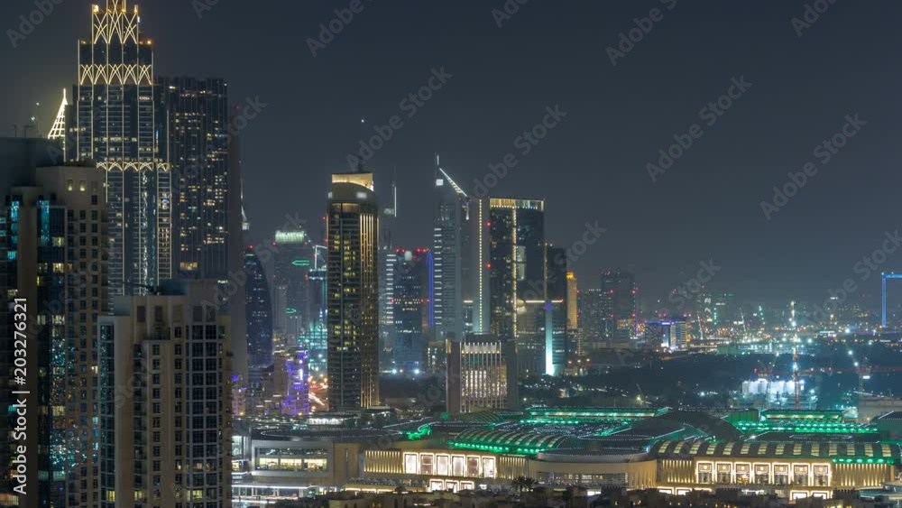 Aerial cityscape timelapse at night with illuminated modern architecture in Downtown of Dubai, United Arab Emirates. Aerial cityscape timelapse at night with illuminated modern architecture in Downtown of Dubai, United Arab Emirates.