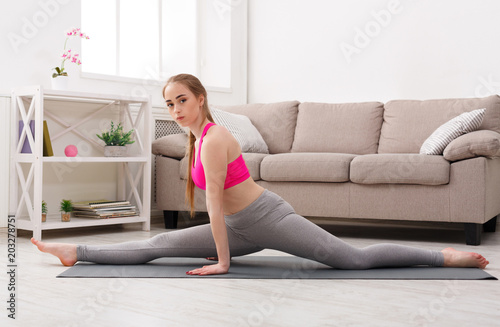 Woman training yoga in monkey pose