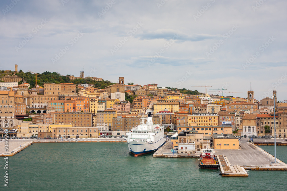 Cityscape of Ancona with ferries at the port viewed from the sea