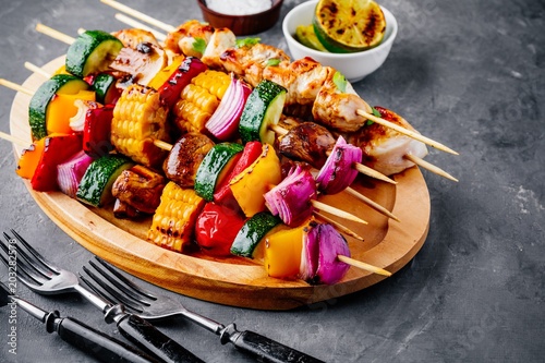 Grilled vegetable and chicken skewers with sweet corn, paprika, zucchini, onion, tomato and mushroom