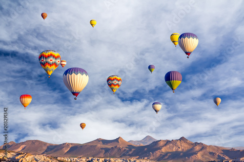 Bright multi-colored hot air balloons flying in sunsrise sky Cappadocia,