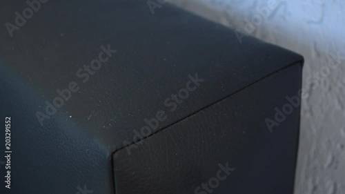 Close up of two hands unplugging a smartphone charger