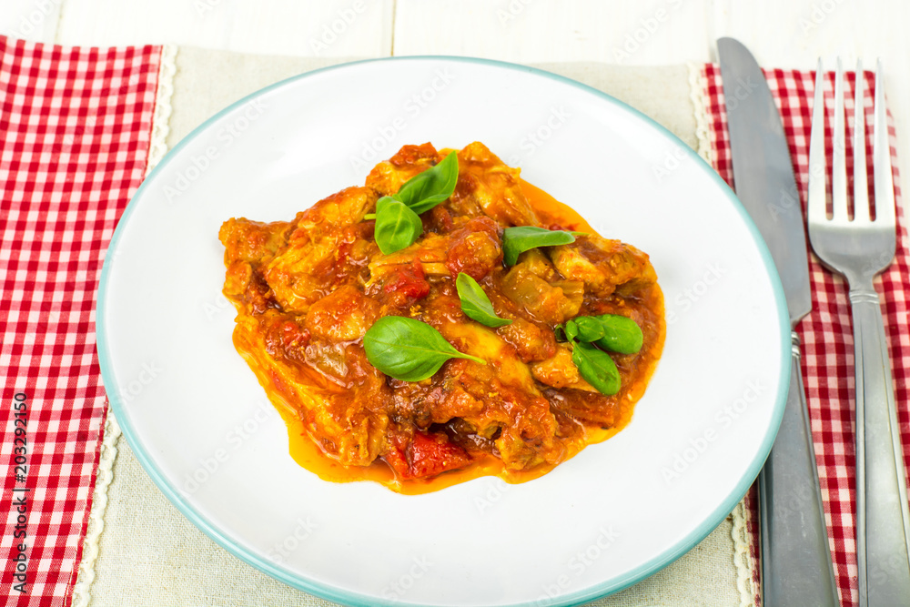 Fillet meat chicken, turkey with paprika and tomatoes Fillet meat chicken, turkey with paprika and tomatoes