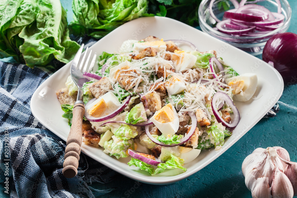 Healthy caesar salad with cheese, eggs and croutons Healthy caesar salad with cheese, eggs and croutons