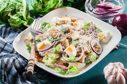 Healthy caesar salad with cheese, eggs and croutons