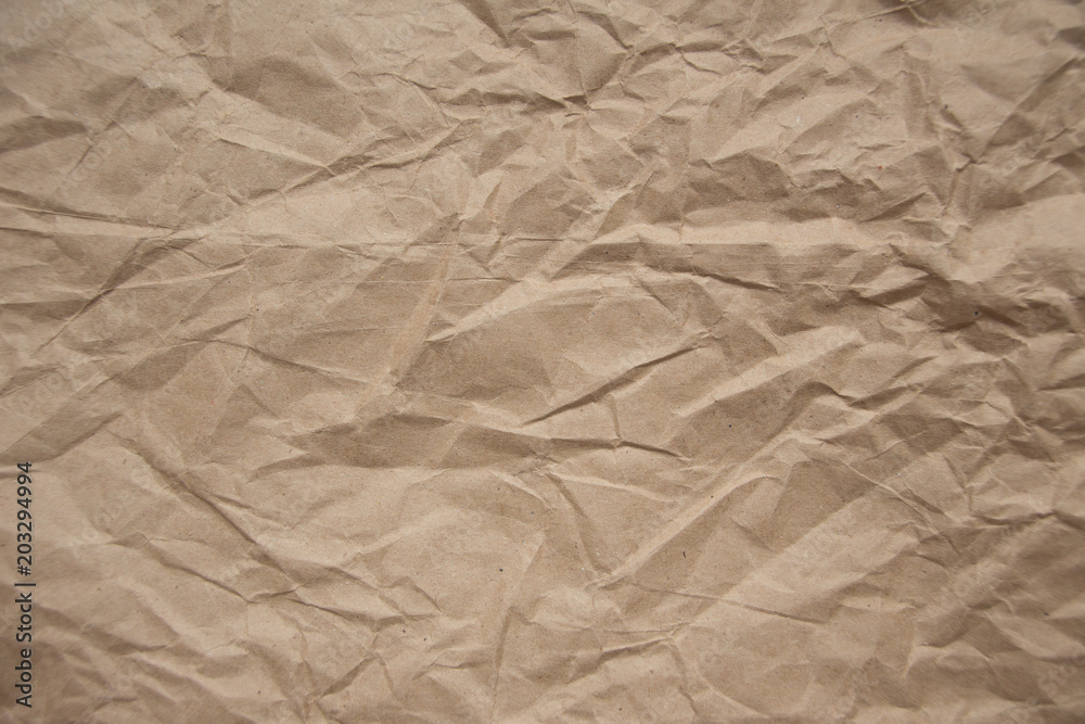 Obraz premium Brown rough crumpled recycled paper texture