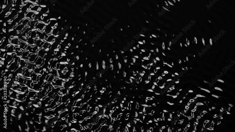 Vibrations and dark water liquid over a subwoofer audio speaker. Black background. Slow motion