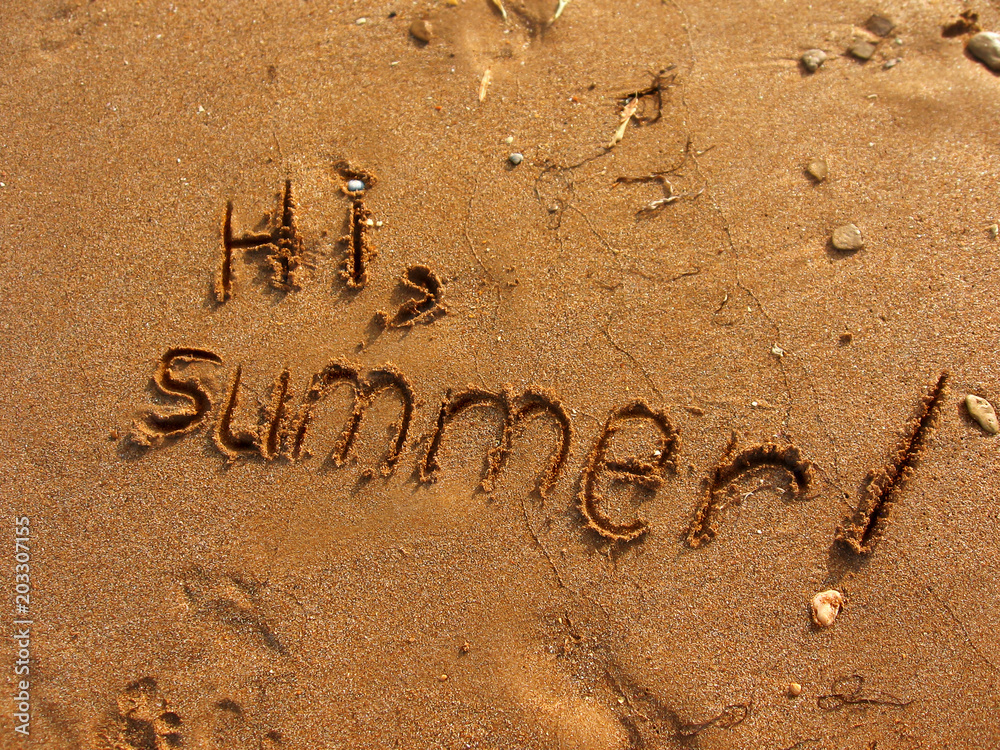 Fototapeta premium Hi, Summer written on the sand. Textured sandy template for vacation concepts. Natural sea beach background