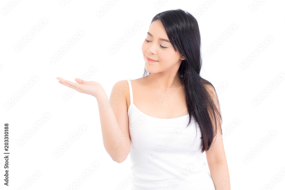 Asian beautiful young woman showing with healthy clean skin presenting something empty copy space on the hand isolated on white background, beauty concept. Asian beautiful young woman showing with healthy clean skin presenting something empty copy space on the hand isolated on white background, beauty concept.