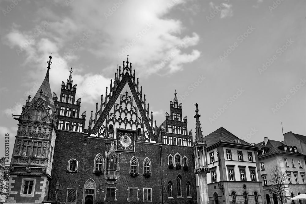 Obraz premium Wroclaw Town Hall at Market Square against bright summer sky. Historical capital of Silesia Poland, Europe. Travel vacation concept. Black and White