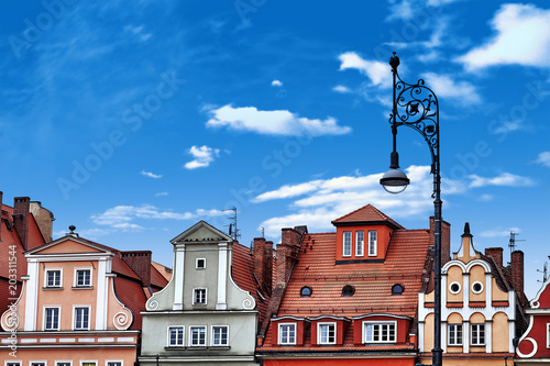 Central market square in Wroclaw Poland with old colourful houses, street lantern lamp. Travel vacation concept