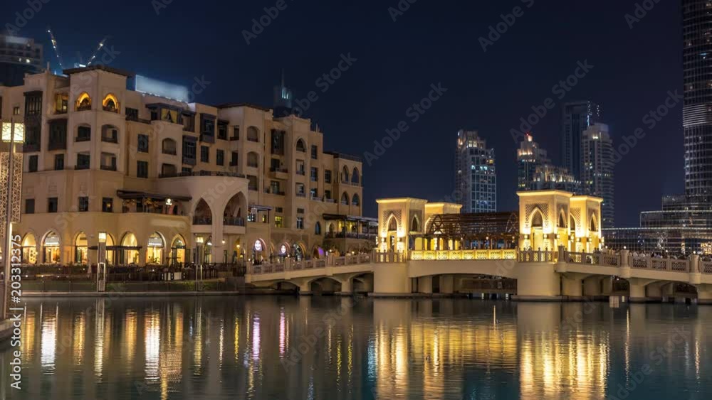 The bridge near the biggest musical fountain in Dubai day to night timelapse. Dubai, UAE The bridge near the biggest musical fountain in Dubai day to night timelapse. Dubai, UAE