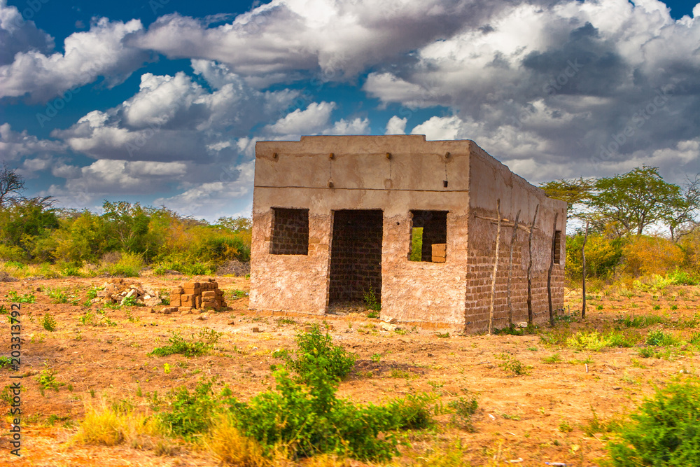 Unfinished house in the savannah. Africa. Kenya. Abandoned house in Africa.