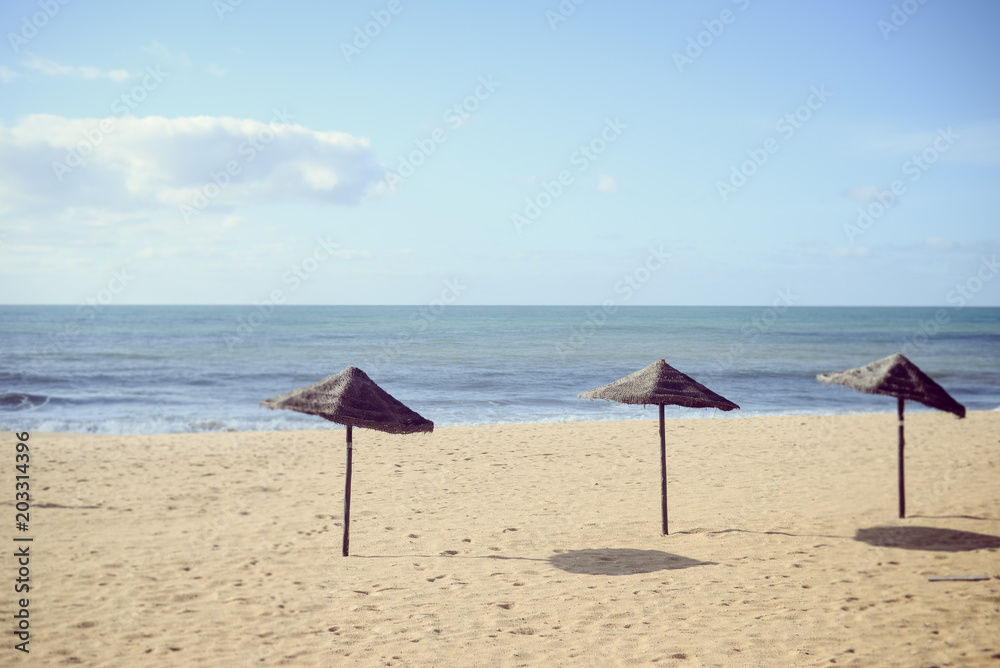 Beach Umbrella - tropical holiday tranquility background. Sunny outdoors seascape